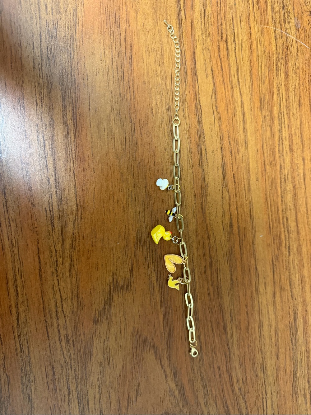 Gold-Tone Charm Bracelet with Yellow and White Enamel Charms